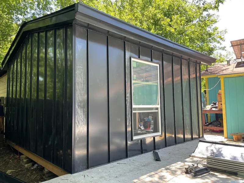Black standing seam metal wall panels for Roof Inspection in Forrest City